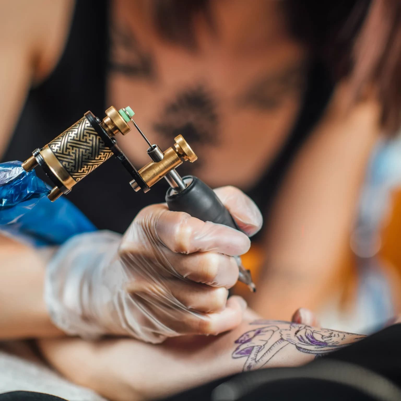 Photo from M.INK Tattooing's website